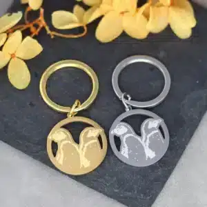 Porte-clés couple pingouins acier 1