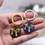 Porte-clés couple pingouins acier 2