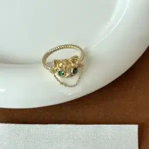 Bague femme tête de chat dorée chaîne 1