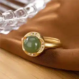 Bague femme fleur dorée brillante perle verte 1