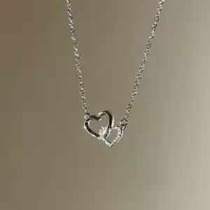Collier femme breloque double coeurs 1
