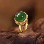 Bague femme princesse ronde dorée et verte 1