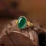 Bague femme princesse dorée pierre verte ovale 1
