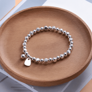 Bracelet femme perles argent élastique.