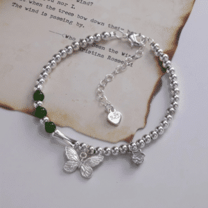 Bracelet femme acier papillon pierres vertes